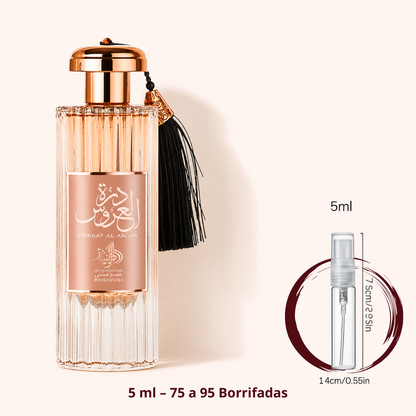 Al Wataniah Durrat Al Aroos — frasco ao lado de um decant spray de 5 ml, para comparar o tamanho; cerca de 75 a 95 borrifadas